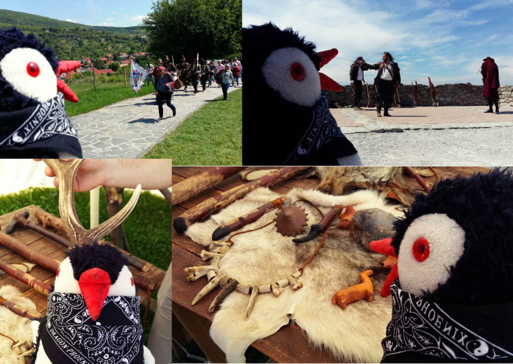 A plush penguin toy visits historical reenactments and displays at Devín Castle