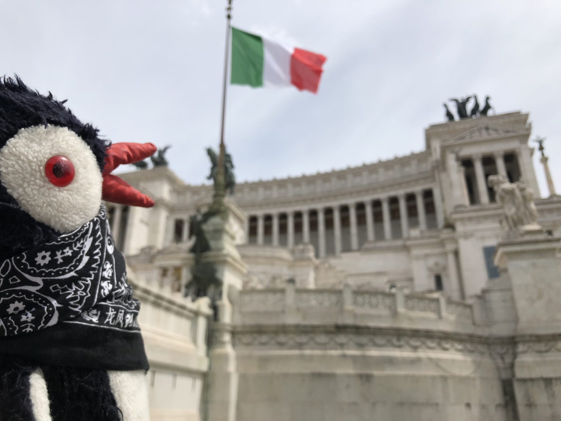 Plush penguin Miško in front of the Altare della Patria in Piazza Venezia
