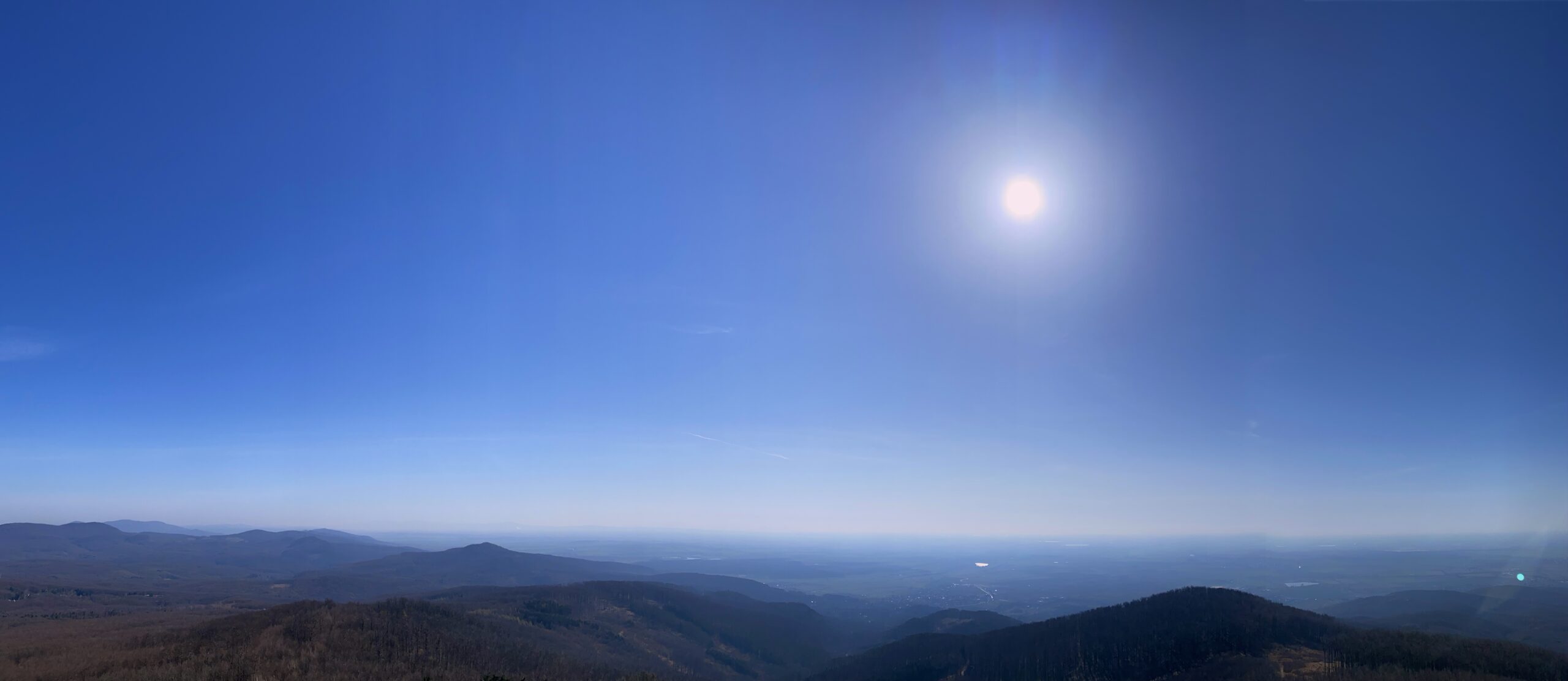 Bright sun shines over the rolling hills of the Little Carpathians
