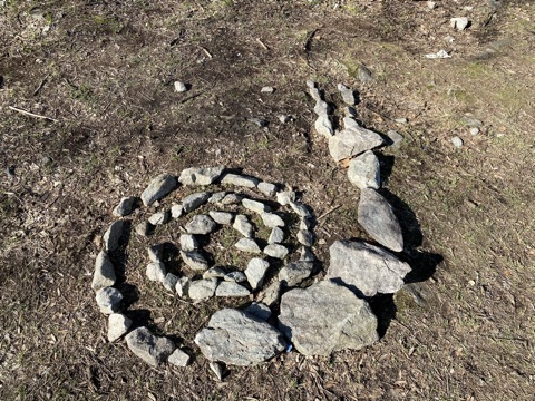 Small rocks arranged to look like a snail near Great Homola Lookout Tower