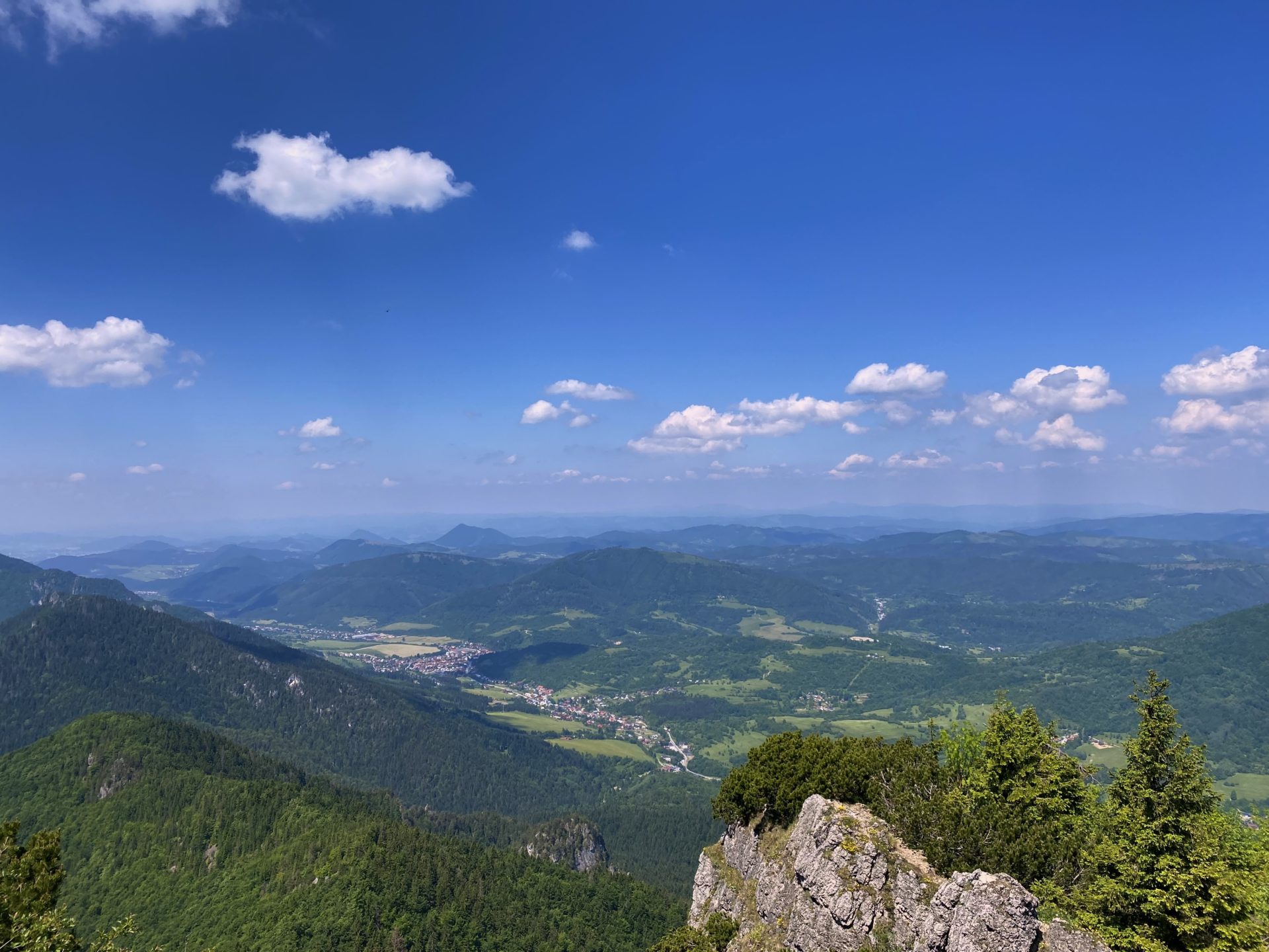 Panoramic view of green mountains and a valley from Malý Rozsutec summit