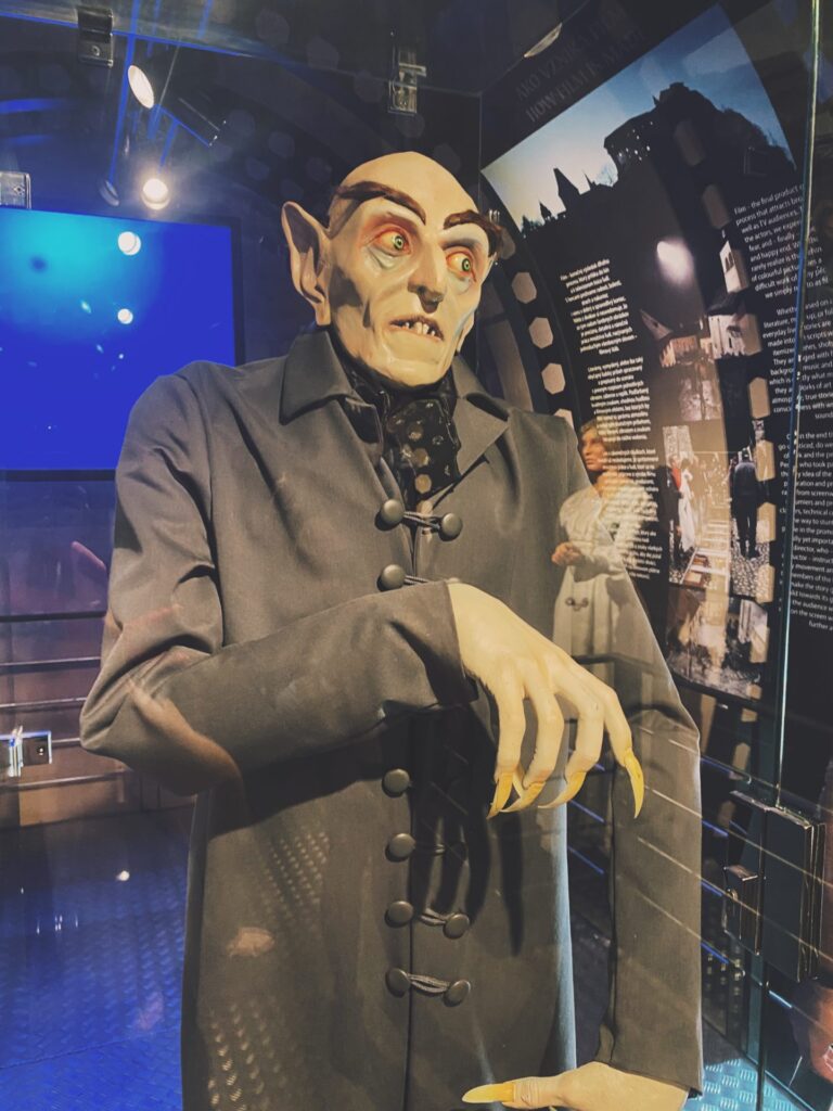 Lifelike vampire figure with long claws displayed inside Orava Castle