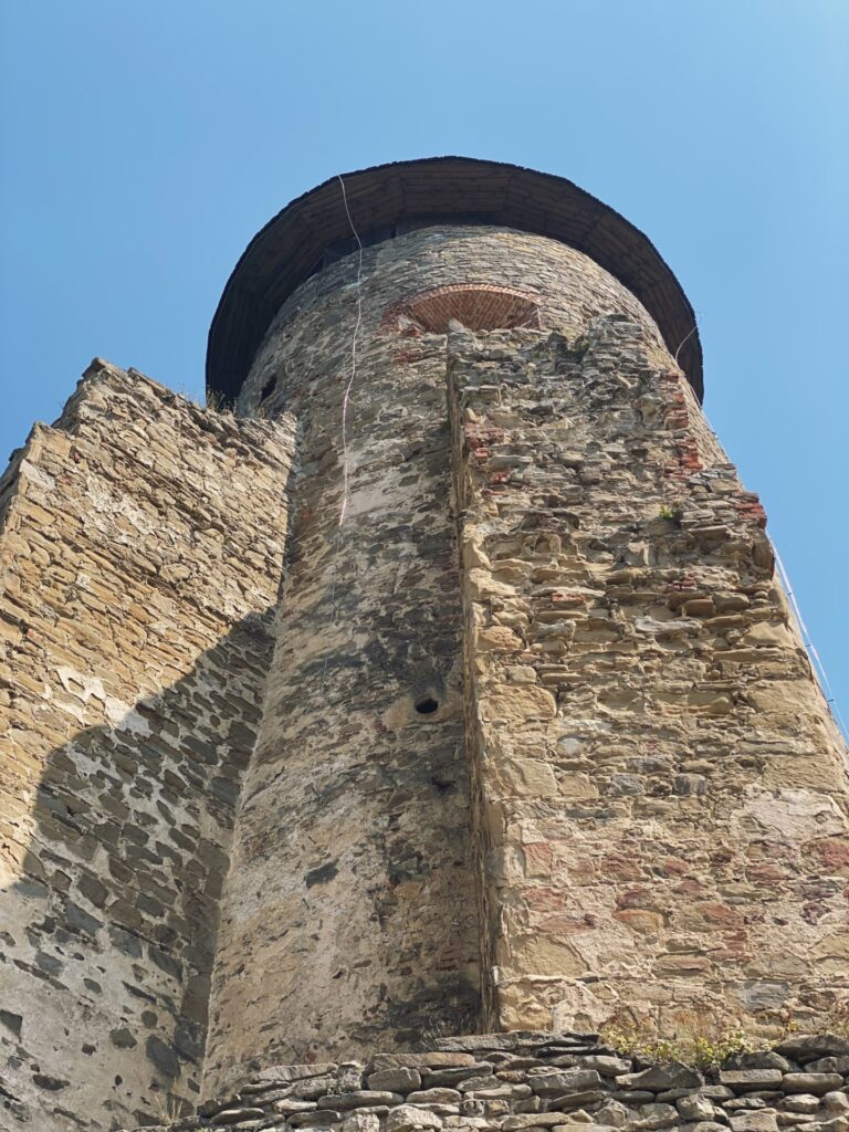 Low angle view of the stone tower at Stará Ľubovňa Castle