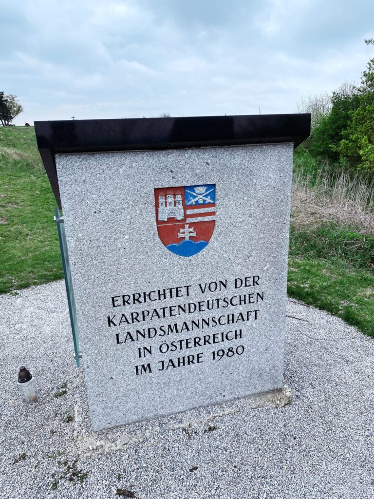 Stone monument with a coat of arms on Braunsberg Hill
