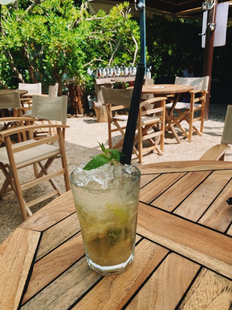 Refreshing mojito on a wooden table at an outdoor cafe on Lokrum Island