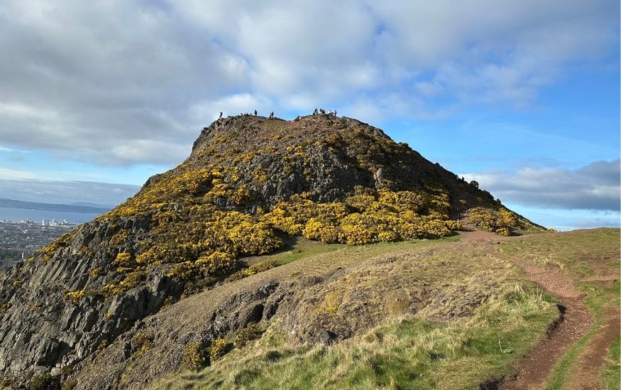 Exploring arthurs Seat edinburgh scotland featured