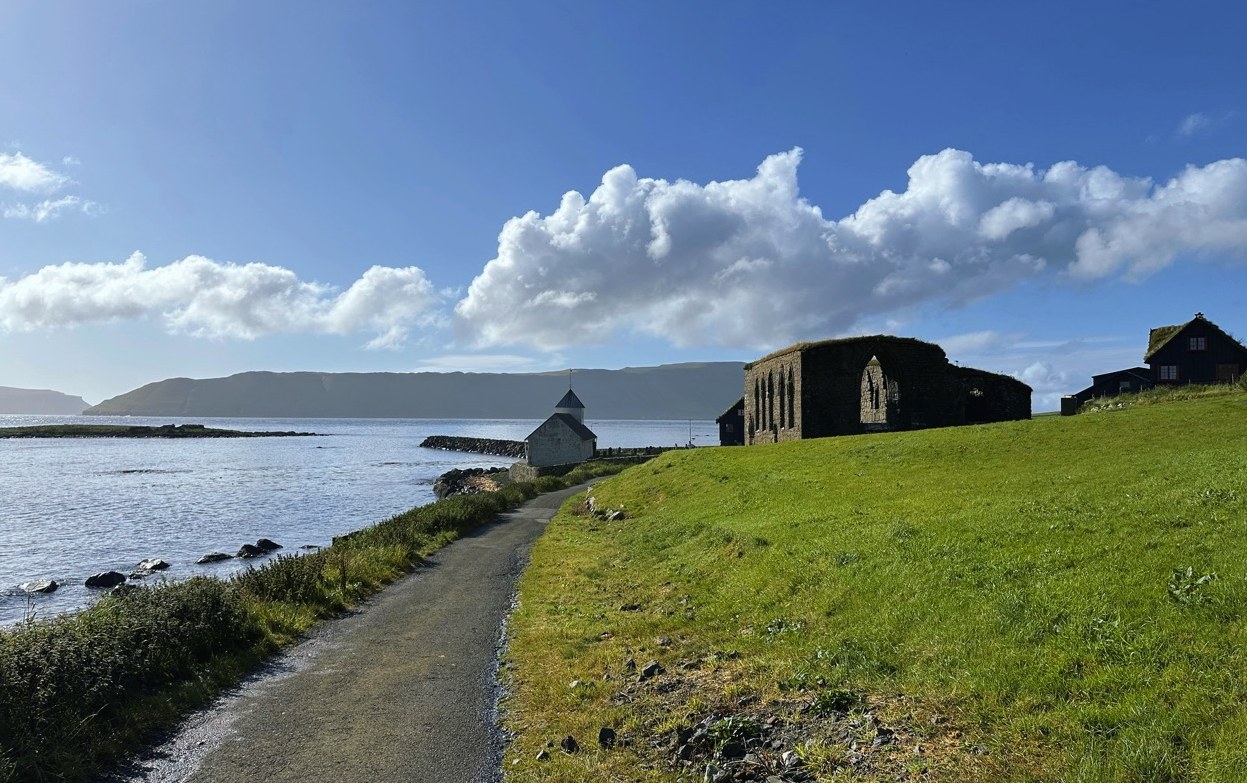 St. Olav's Church and the ruins of the Magnus Cathedral by the sea at Kirkjubøur, Faroe Islands