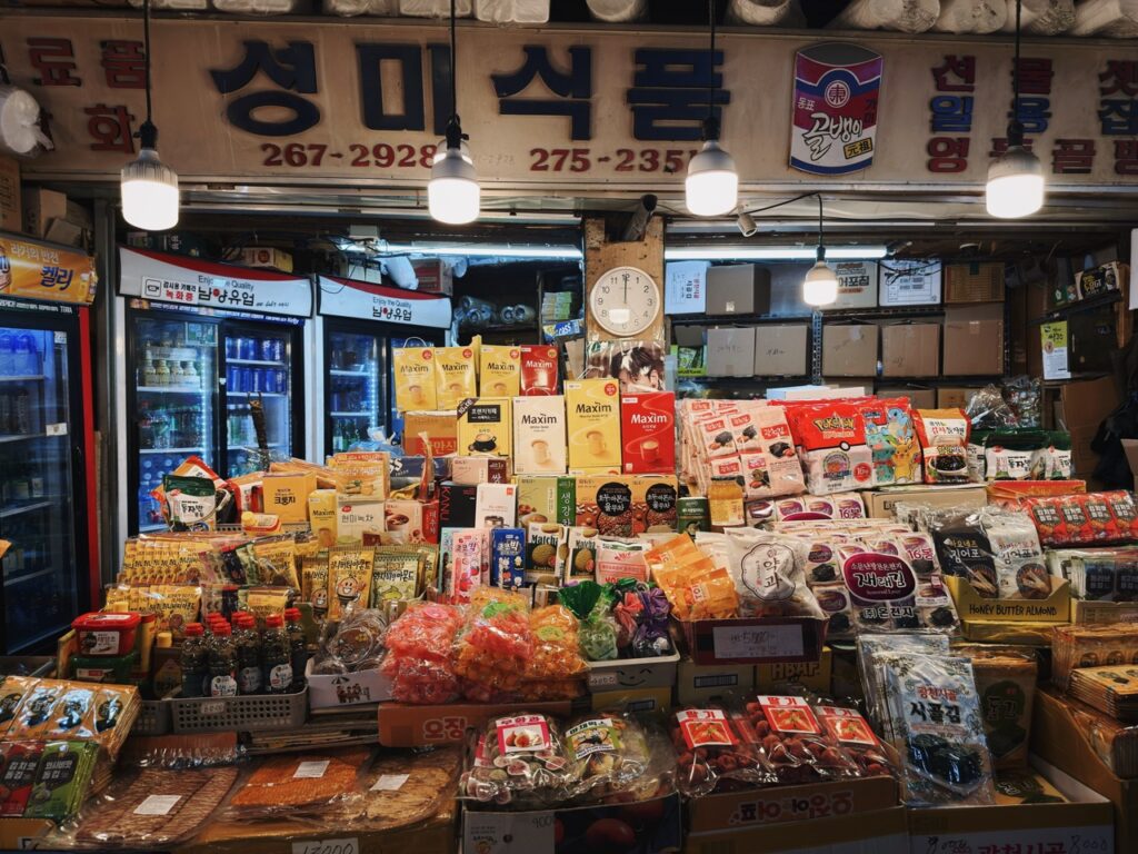 Stalls at Gwangjang Market display a wide variety of packaged snacks and goods