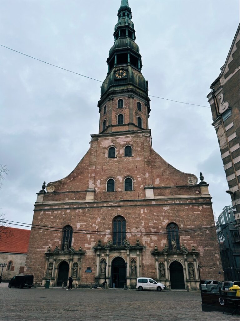 Tall medieval church steeple with spire in Riga