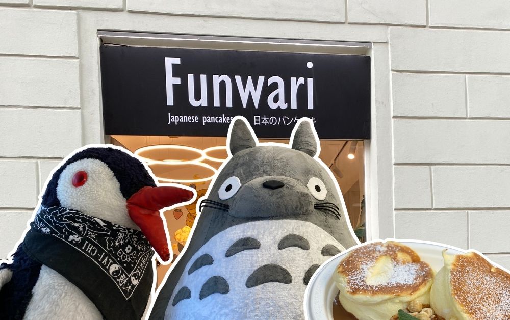 Miško and a plush Totoro sit next to Funwari Japanese pancakes with powdered sugar