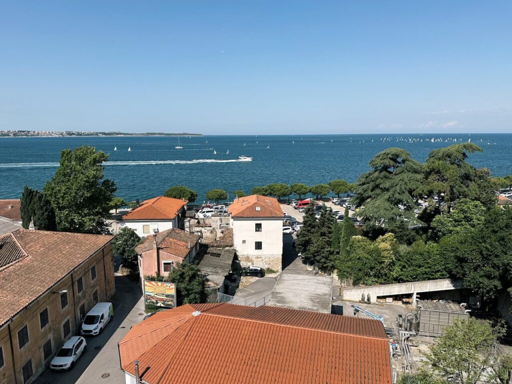 High angle view of Piran with terracotta roofs overlooking the blue Adriatic Sea