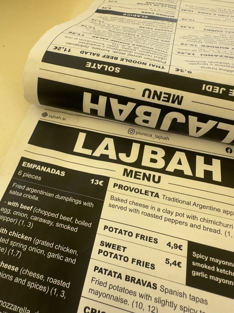 Close-up view of a printed menu from a restaurant in Slovenia